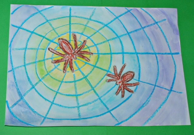 Spider picture with oil pastels and watercolours using different coloured background