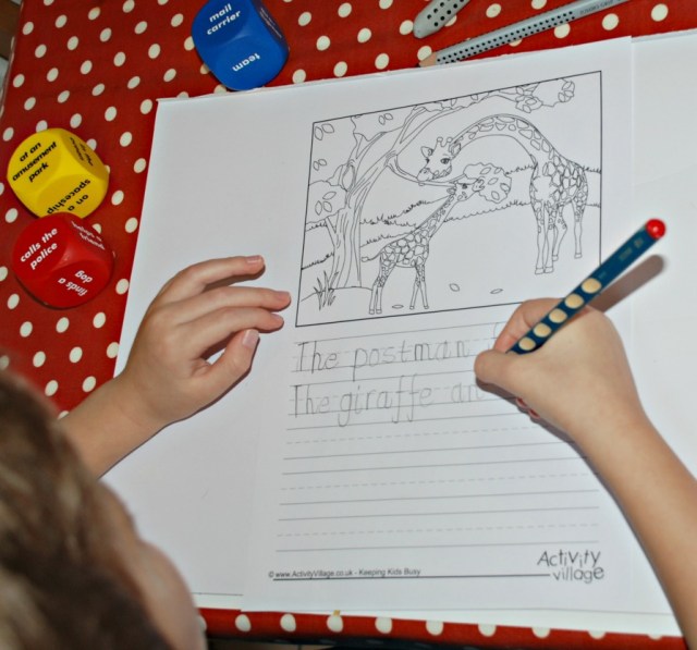 Writing on the themed story writing pages from Activity Village using story starter cubes to give ideas