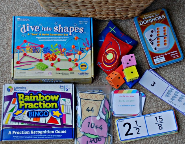 Maths Basket. Including Rainbow Fraction Bingo game, Dive into Shapes, Loop cards, matching cards from Twinkl. Dice and bean bags