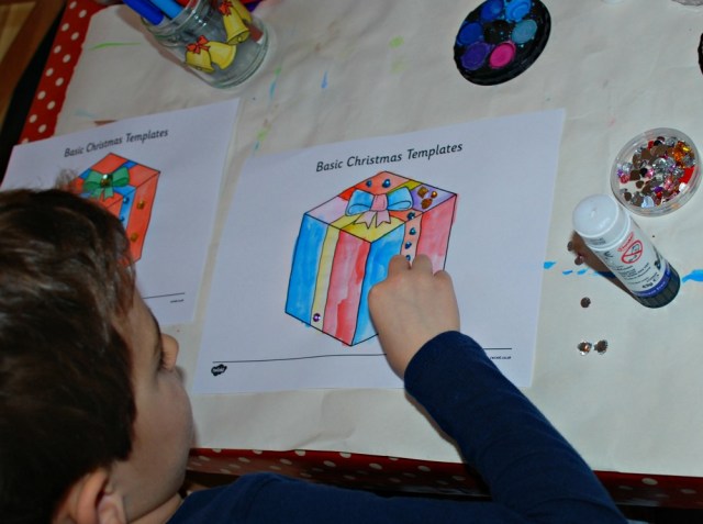 Adding Craft Gems to his painted Christmas Templates