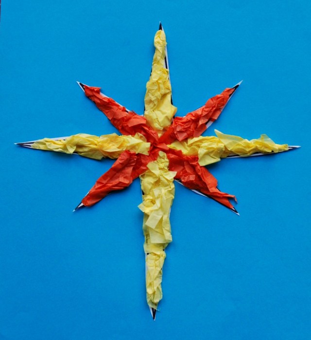 Tissue paper Christmas Star made using one of the Basic Christmas templates from Twinkl Resources