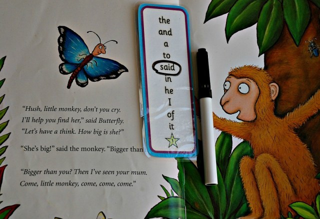 Using a high frequency word bookmark with a story book to search for words