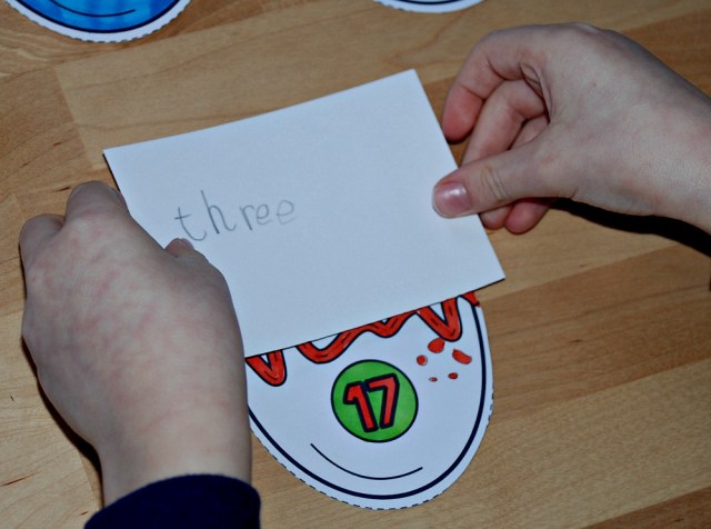 matching the correct number word to the egg half underneath the card (the two halves added together must come to 20)