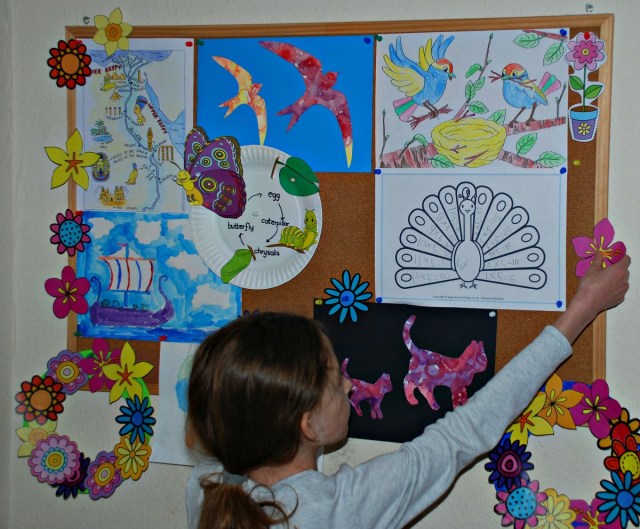 Adding some flower cut-outs to one of our cork boards
