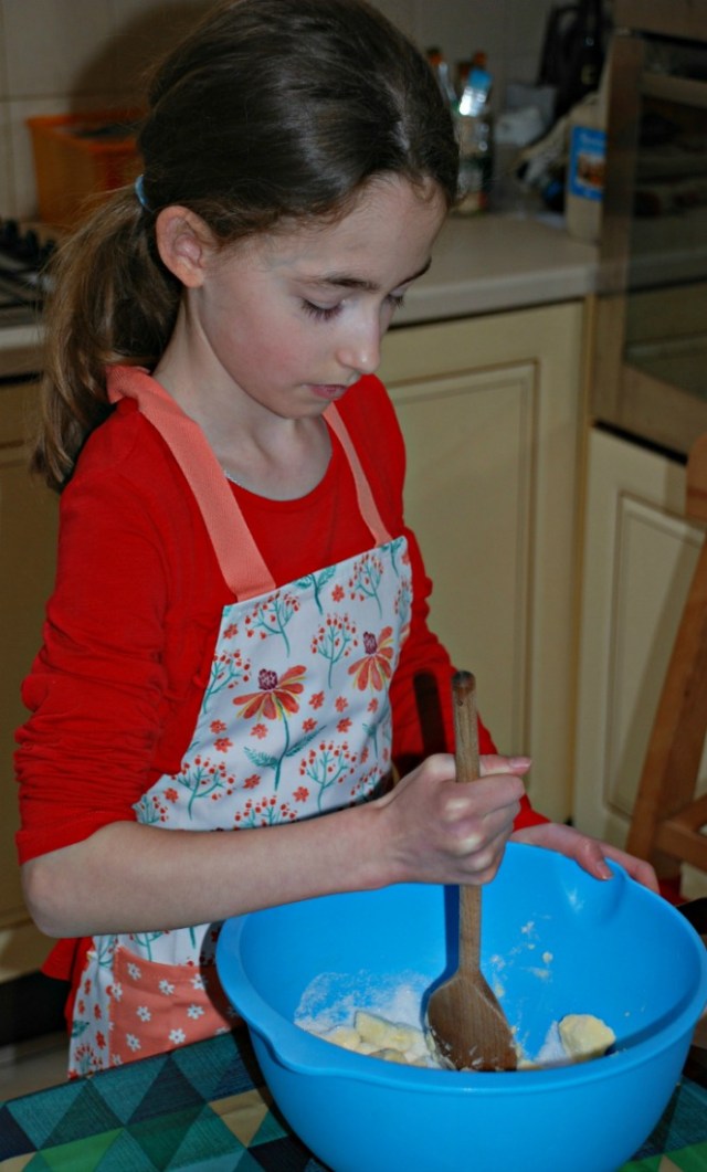 Baking Biscuits with her new apron from Ulster Weavers