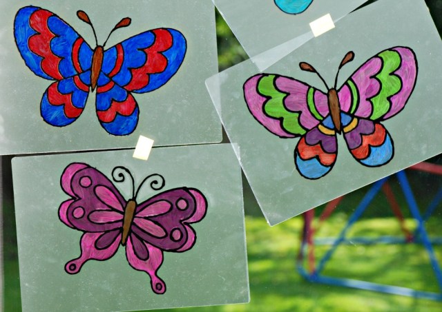 Using butterfly colouring pages to create window art