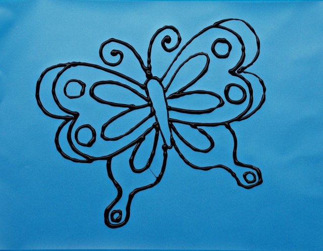 Easy home-made suncatchers. Ouline made using 3D paint onto laminating pouches