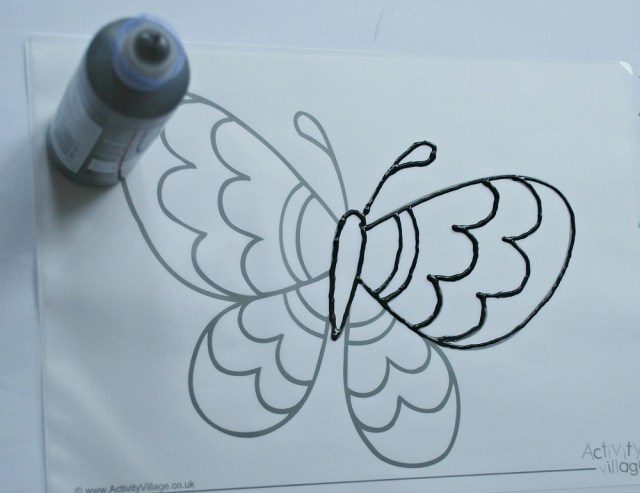 Trace over a colouring page with 3D paint onto a laminating pouch to use as a sun catcher