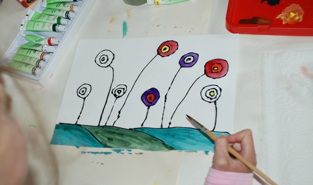 Adding watercolours to our circular flower pictures
