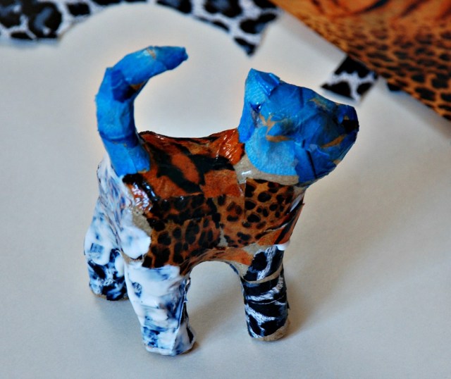 Decoupage cat using Mod Podge the glue dries transparent