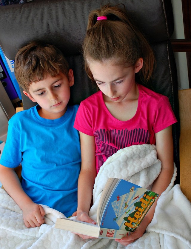 Siblings reading together. Reading Heidi