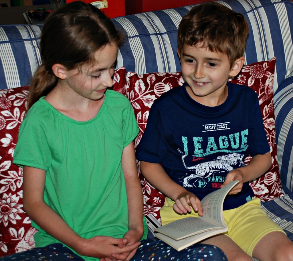Siblings reading aloud together