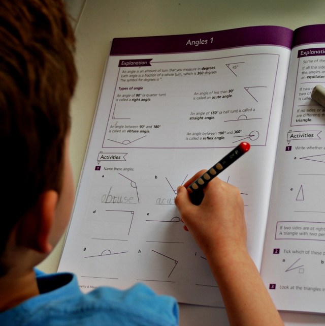 working through his Schofield & Sims Geometry and Measurement workbook