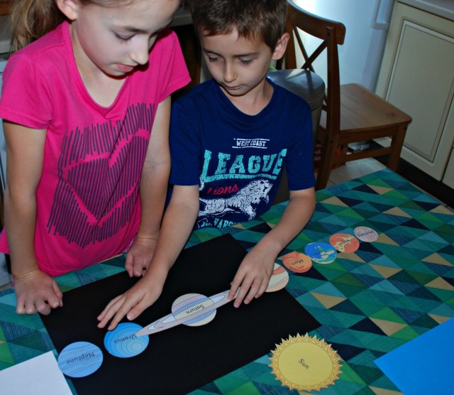 Using the Planet cut-outs from Activity Village to create a Planet poster