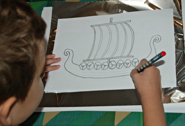 Place the picture ontop of the tin foil and then draw over the outlines to create your picture on the tinfoil