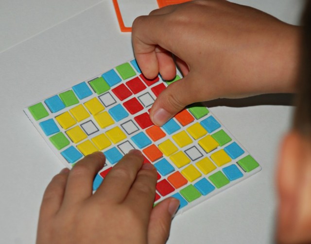 Creating his own designs with the foam craft kits from Baker Ross