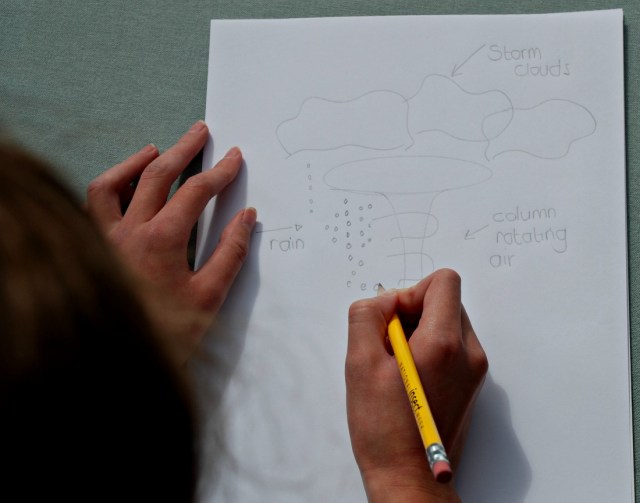 Drawing her own picture of a tornado
