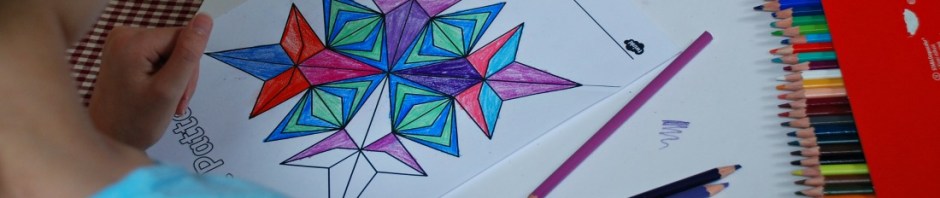 Using the Rangoli Pattern colouring pages from Twinkl to work on lines of symmetry