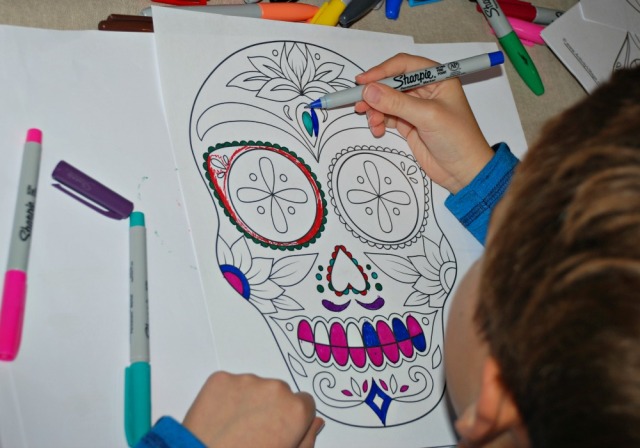 Colouring in a Day of the Dead page from Activity Village