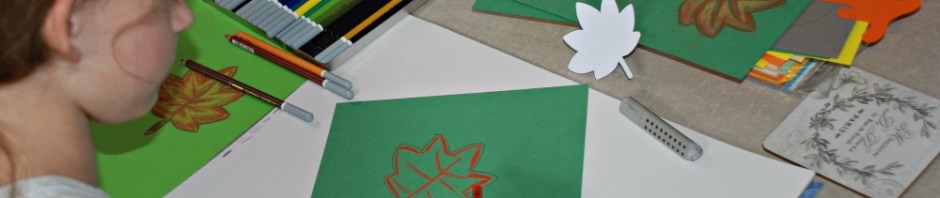 working on her autumn leaf pictures using her chalk pastels