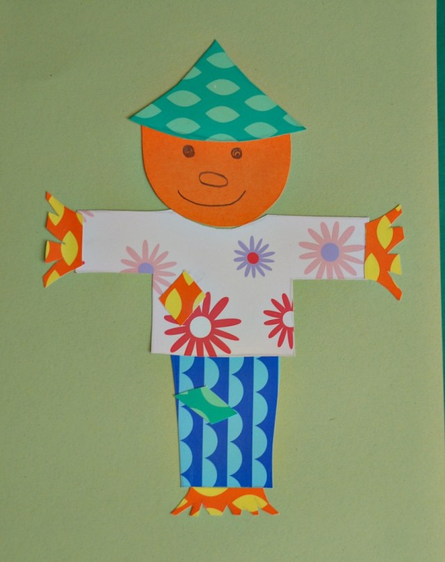 colourful paper collage. a colourful fun scarecrow